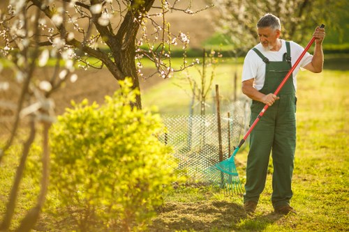 Manager inspecting a lawn during a review visit