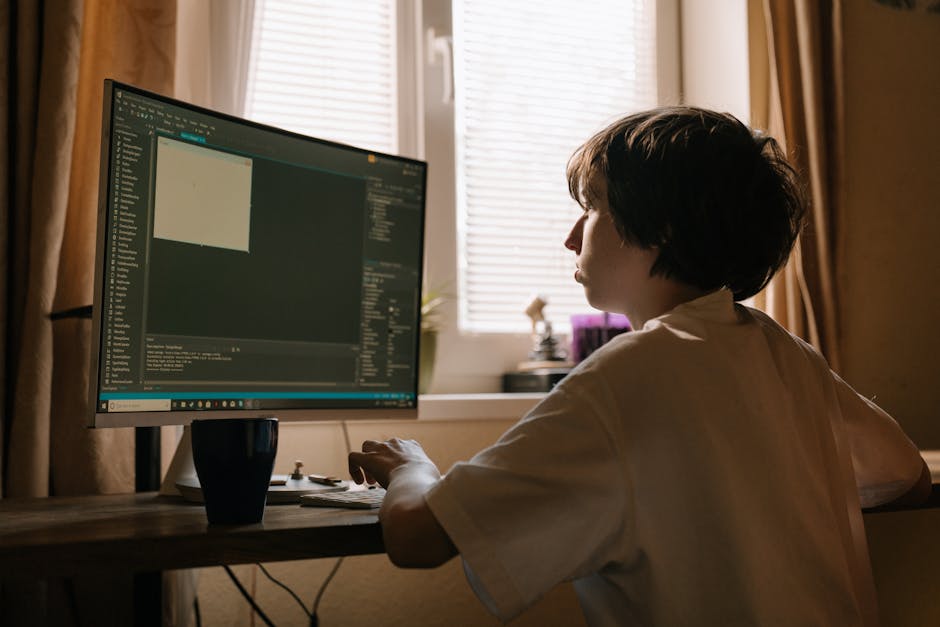 A computer screen displaying a dense, colorful code editor filled with lines of JavaScript or similar programming language, featuring multicolored syntax highlighting such as blue, green, yellow, and